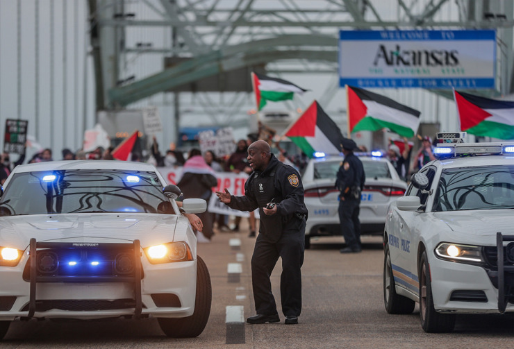 <strong>Memphis police officers figure out how to respond to a pro-Palestinian protest that shut the Interstate 40 bridge over the Mississippi River Feb. 3.</strong> (Patrick Lantrip/The Daily Memphian)