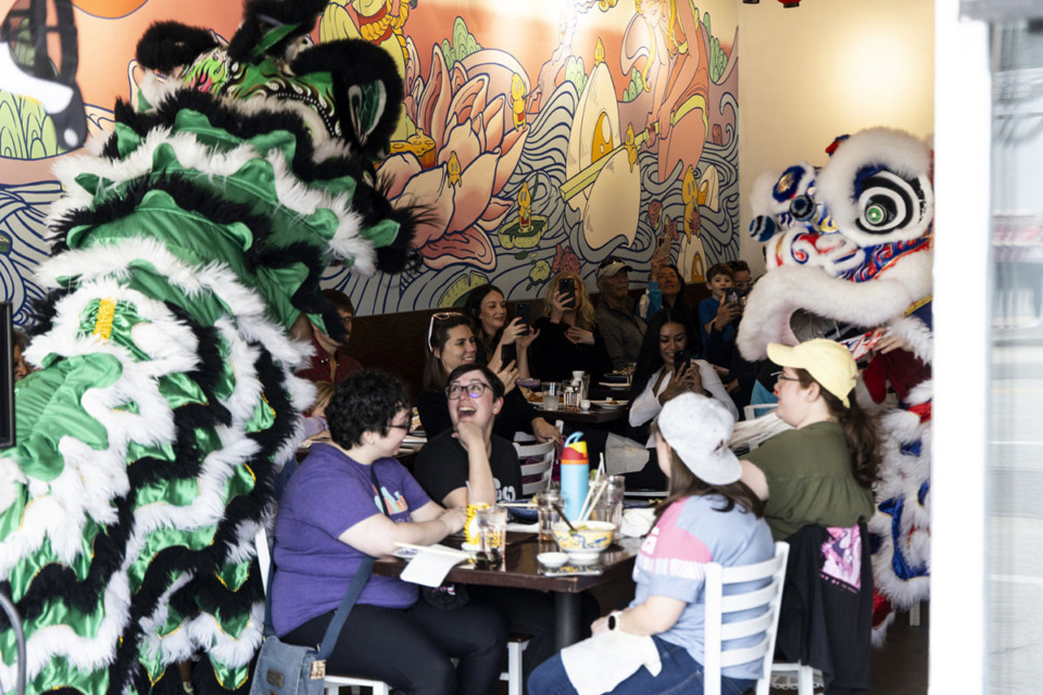 <strong>Members of Sacred Heart Lion Dance perform a lion dance at Good Fortune Co.</strong> (Brad Vest/Special to The Daily Memphian)