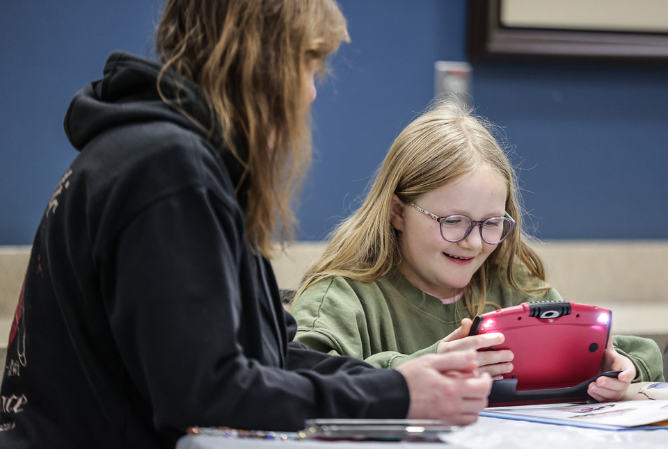 <strong>Eight-year-old Marley Brewer smiles while learning to use a vision aid for children with low vision called an electronic video magnifier at Southern College of Optometry Feb. 1, 2024.</strong> (Patrick Lantrip/The Daily Memphian)
