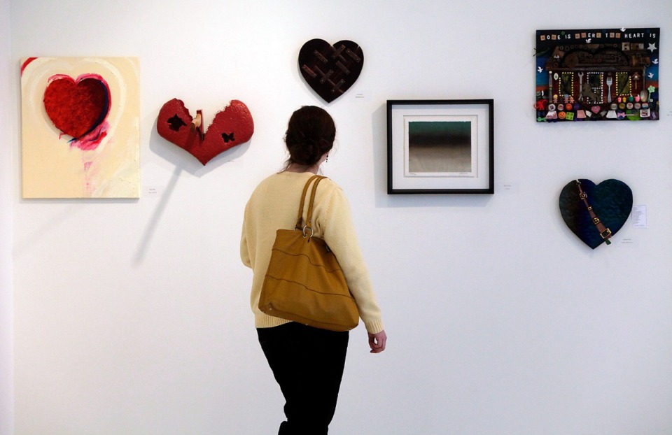 <strong>Gadsby Creson looks at pieces in &ldquo;Works of Heart,&rdquo; an annual Valentine auction and exhibition to benefit the Memphis Child Advocacy Center.</strong> (Daily Memphian file)