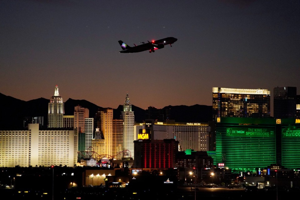 <strong>A plane takes off from Harry Reid International Airport near casinos along the Las Vegas Strip, on Sept. 29, 2021, in Las Vegas.&nbsp;</strong> (AP Photo/John Locher, File)