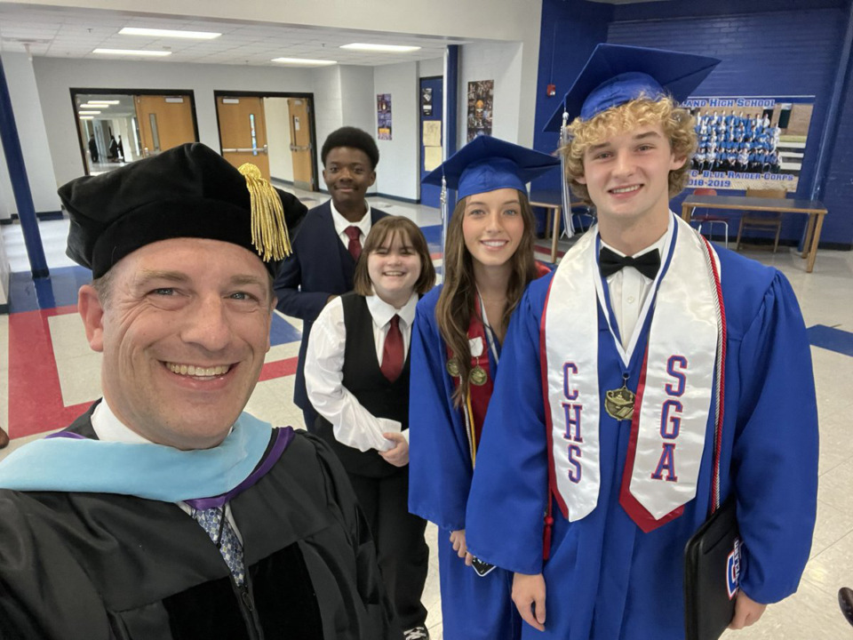 <strong>Russell Dyer (left) takes a selfie with students.</strong> (Courtesy Cleveland City Schools)