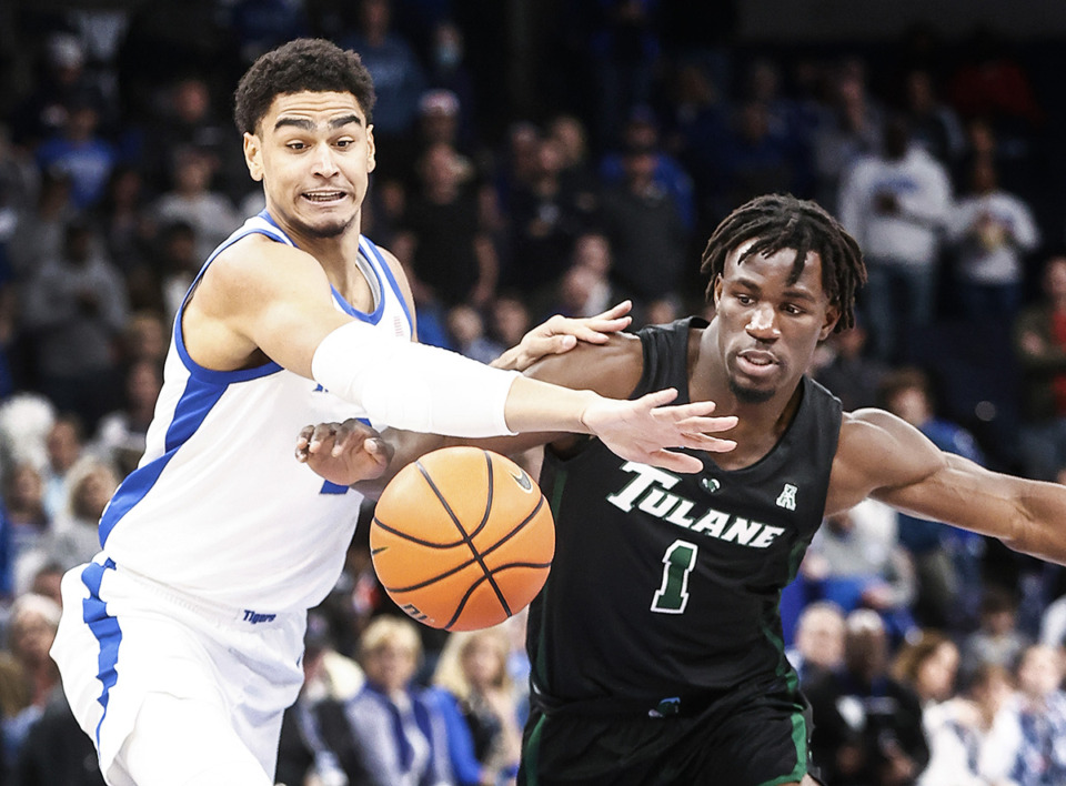 <strong>University of Memphis defender Nicholas Jourdain, left, and Tulane University guard Sion James, right, battle for a loose ball during action on Sunday, February 11, 2024.</strong> (Mark Weber/The Daily Memphian)