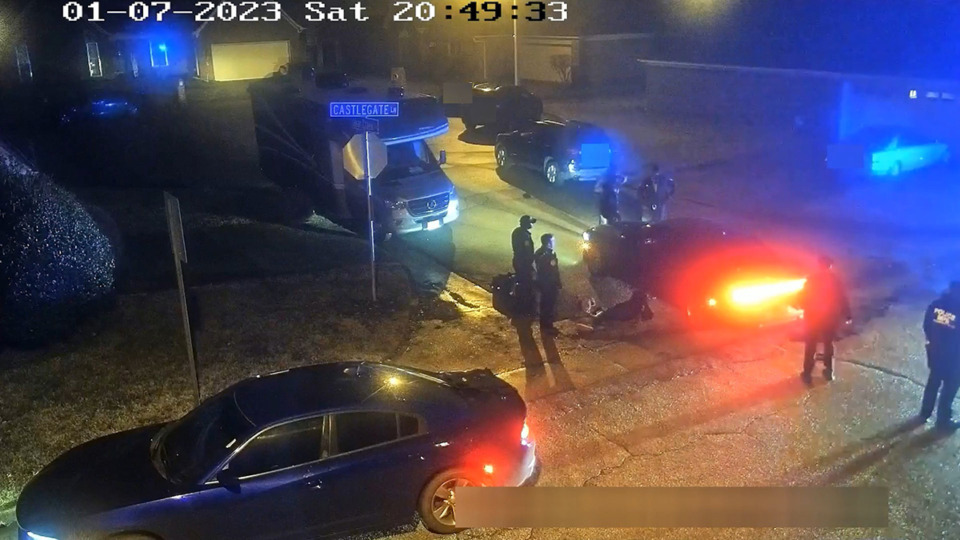 <strong>The pole-mounted camera shows the two Memphis Fire Department EMTs, multiple Memphis Police Officers and a Shelby County Sheriff&rsquo;s deputy standing near Tyre Nichols.</strong> (Screenshot)