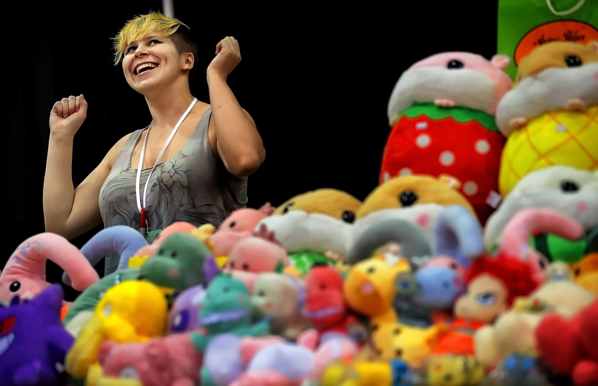 <strong>Vendor Eli Childress of Denver, Colorado, jokes with customers while selling stuffed versions of their favorite anime characters at Anime Blues Con 9 at the Memphis Convention Center on Friday, July 12. Organizers expect some 4,000 fans at the event, which includes cosplay competitions, memorabilia vendors, video games and celebrity speakers. </strong>(Jim Weber/Daily Memphian)