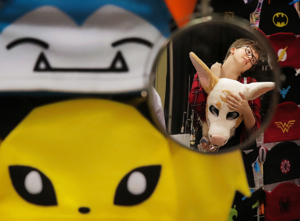 <strong>Mac Gilmore, 17, of Pensacola, Florida, rolls the kinks out of her neck after wearing her heavy costume head on the first day of Anime Blues Con 9 at the Memphis Convention Center Friday, July 12.</strong> (Jim Weber/Daily Memphian)