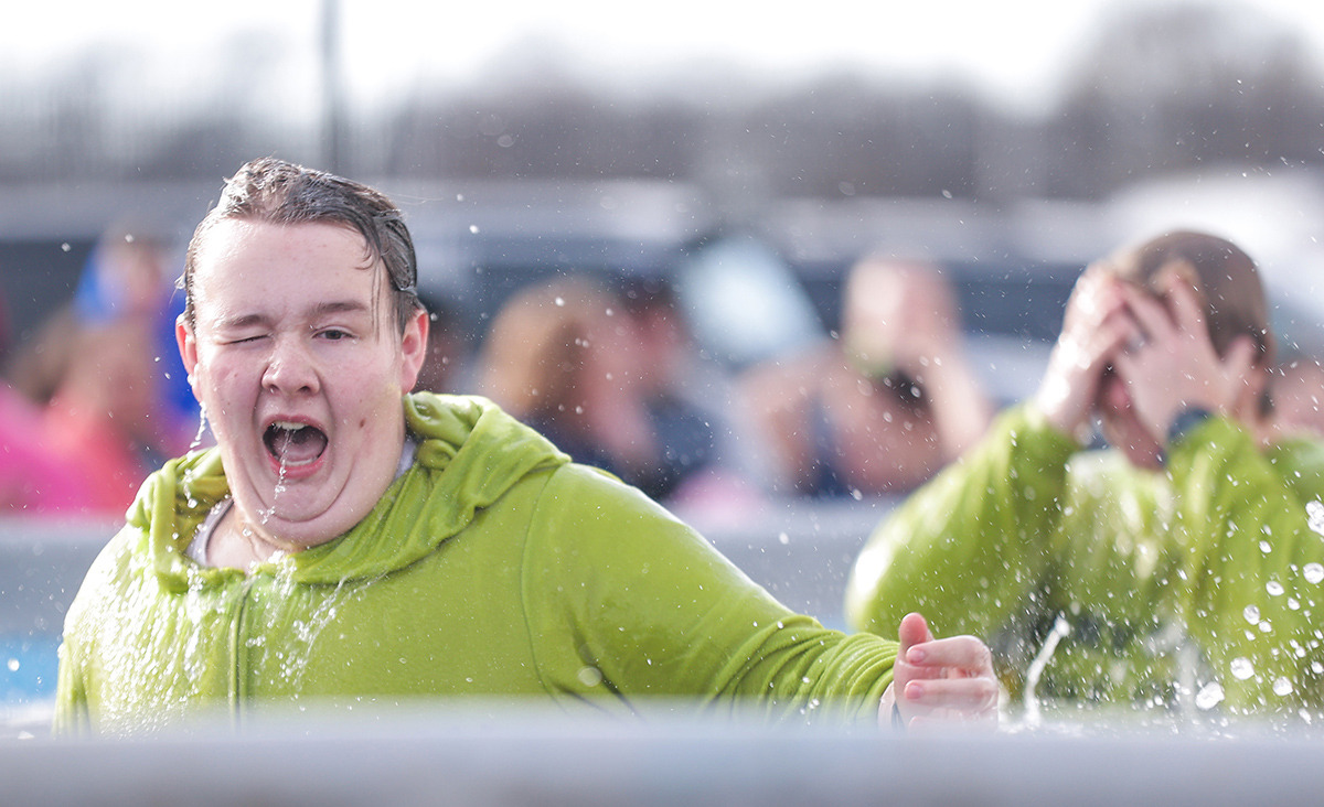 <strong>Eli Copous, dressed as the Grinch, reacts to the icy water after participating in the 17th annual Chili Cook-off and 26th annual Polar Bear Plunge Feb. 17.</strong> (Patrick Lantrip/The Daily Memphian)