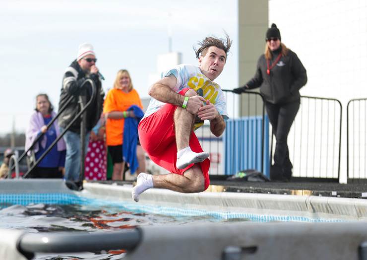 <strong>Spencer Cruz dives into a frigid pool outside the Simmons Bank Liberty Stadium during the 17th annual Chili Cook-off and 26th annual Polar Bear Plunge Feb. 17.</strong> (Patrick Lantrip/The Daily Memphian)