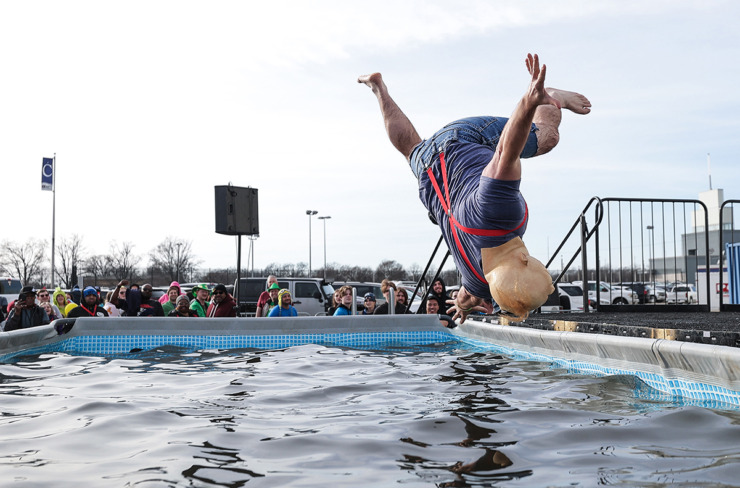 <strong>Keith Bilbrey, dressed as Sloth from &ldquo;The Goonies,&rdquo; does a flip during the 17th annual Chili Cook-off and 26th annual Polar Bear Plunge Feb. 17.</strong> (Patrick Lantrip/The Daily Memphian)