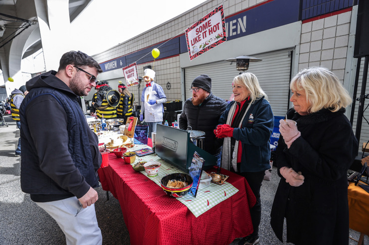 <strong>From left: John Austin Williams, Debby Williams and Carol Easley hand out samples of their chili during the 17th annual Chili Cook-off and 26th annual Polar Bear Plunge Feb. 17.</strong> (Patrick Lantrip/The Daily Memphian)
