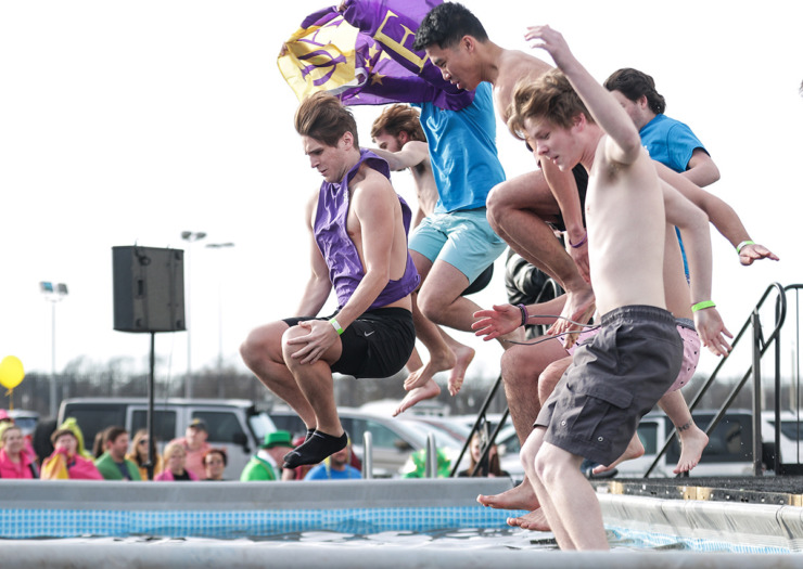 <strong>Members of the Sigma Alpha Epsilon fraternity take a dive in unison during the 17th annual Chili Cook-off and 26th annual Polar Bear Plunge Feb. 17.</strong> (Patrick Lantrip/The Daily Memphian)