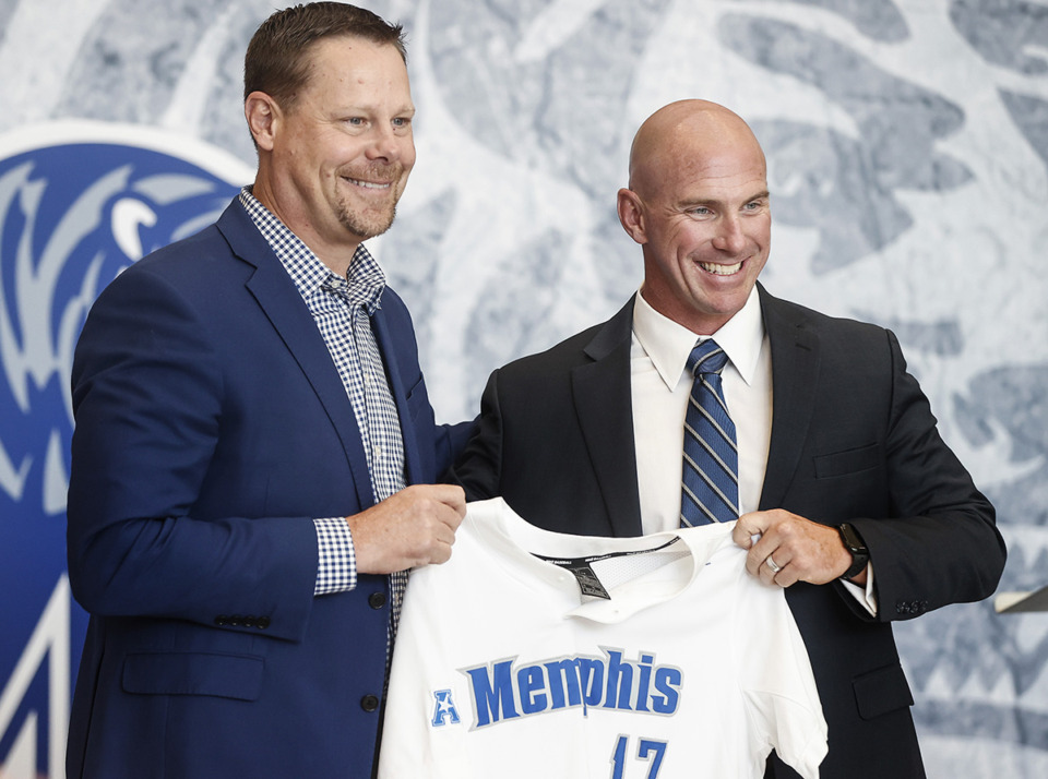 <strong>Laird Veatch, (left) University of Memphis athletic director, introduces new baseball coach Matt Riser (right) during a ceremony at Laurie-Walton Basketball Center on June 22, 2023. The Tigers baseball team earned their first win under the new coach Saturday, Feb. 17, over&nbsp;Jacksonville State.</strong> (Mark Weber/The Daily Memphian file)