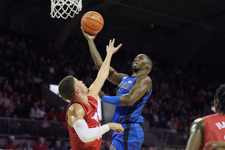 <strong>Memphis forward David Jones (8) shoots against SMU forward Samuell Williamson (10) during the first half of an NCAA college basketball game in Dallas, Sunday, Feb. 18, 2024.&nbsp;</strong>(LM Otero/AP Photo)