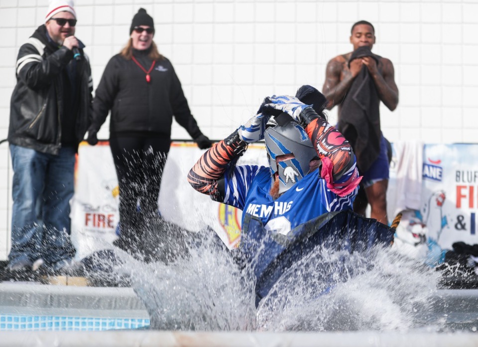 <strong>Longtime Tiger fan Phil Glass jumps takes a dive in his gameday attire during the 17th Annual Chili Cook-off and 26th Annual Polar Bear Plunge Feb. 17.</strong> (Patrick Lantrip/The Daily Memphian)