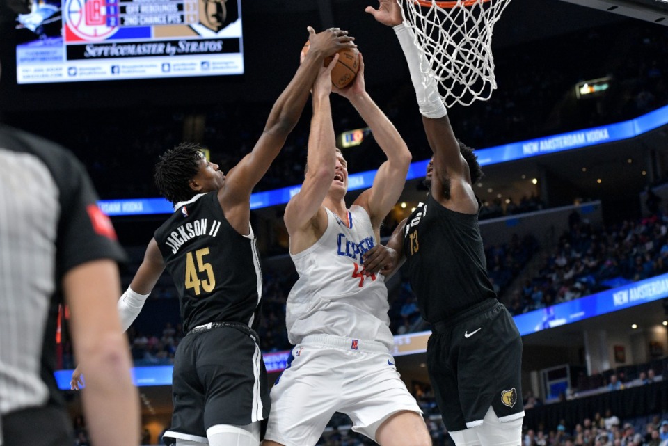 <strong>Memphis Grizzlies forward GG Jackson II (45) blocks Los Angeles Clippers center Mason Plumlee (44), assisted by Jaren Jackson Jr. (right) on Friday, Feb. 23, 2024.</strong> (Brandon Dill/AP)