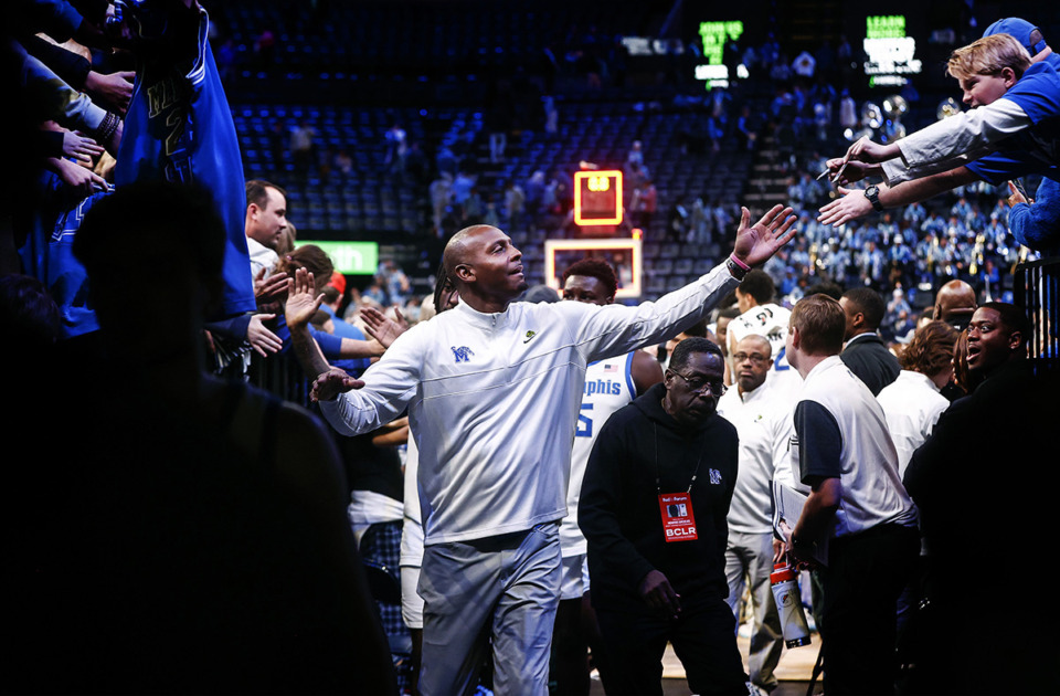 <strong>University of Memphis head coach Penny Hardaway celebrates with fans after beating Tulane University Feb. 11.</strong> (Mark Weber/The Daily Memphian)