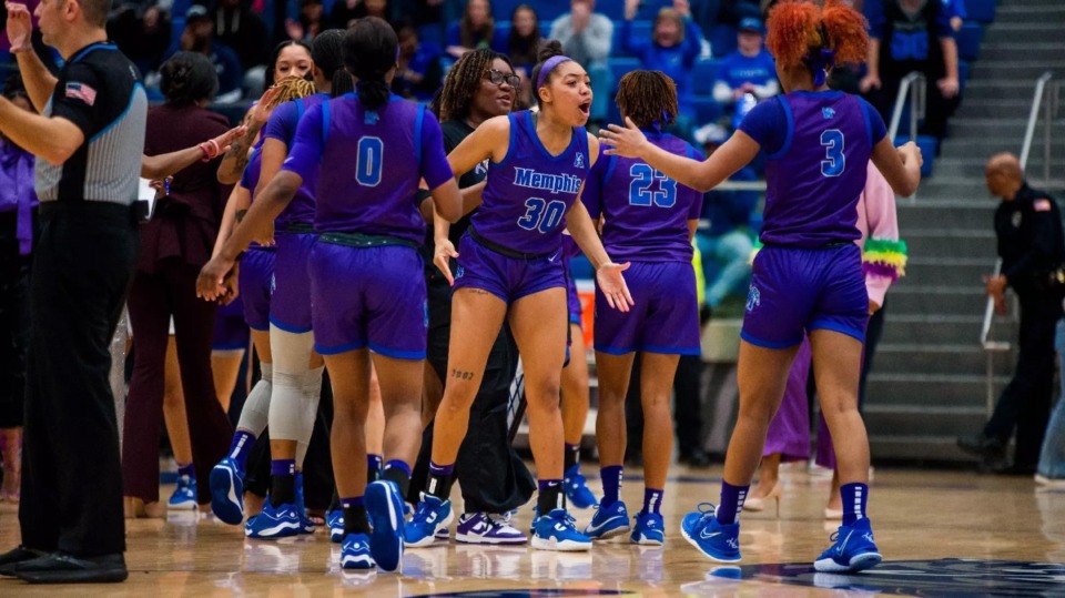 <strong>Alasia Smith (30) celebrates with teammates after the Tigers&rsquo; win over Tulane in New Orleans.</strong> (Matthew A. Smith/Memphis Athletics)