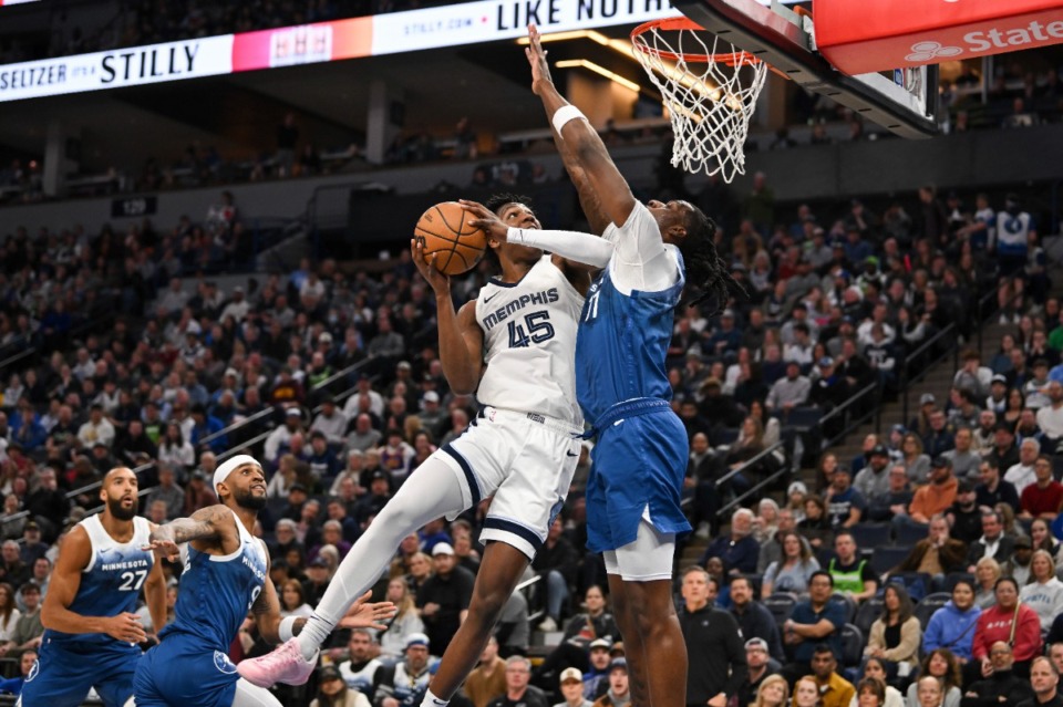 <strong>Memphis Grizzlies forward Gregory Jackson (45) goes up for a shot against Minnesota Timberwolves center Naz Reid on Wednesday, Feb 28, 2024, in Minneapolis.</strong> (Craig Lassig/AP)