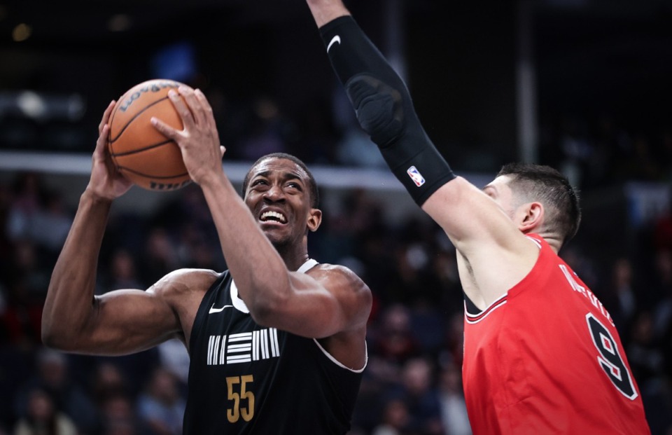 <strong>Playing in the NBA is a dream job for Memphis Grizzlies center Trey Jemison&nbsp;(55, with ball).</strong> (Patrick Lantrip/The Daily Memphian file)