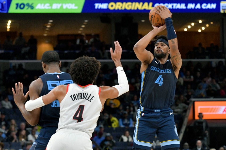 <strong>Memphis Grizzlies guard Jordan Goodwin, right, shoots over Portland Trail Blazers guard Matisse Thybulle, front left, on Friday, March 1, 2024.</strong> (Brandon Dill/AP)