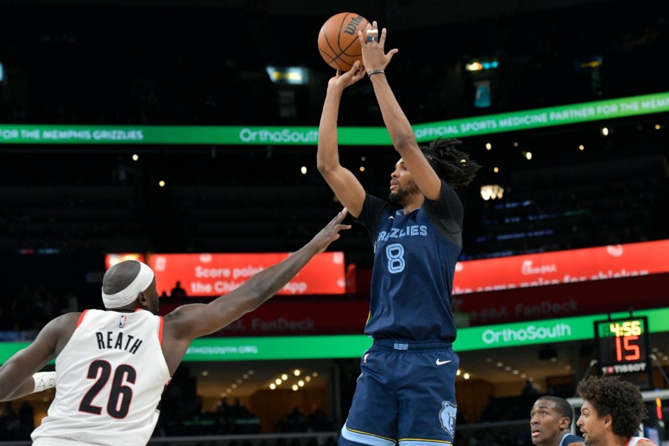 <strong>Memphis Grizzlies forward Ziaire Williams (8) shoots over Portland Trail Blazers center Duop Reath (26) on Friday, March 1, 2024.</strong> (Brandon Dill)