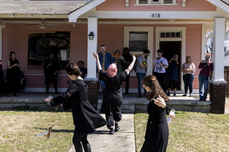 <strong>Mary Jo Karimnia, center, participates during the Pizza Witches dance ceremony at Studiohouse on Malvern during their second open house.</strong> (Brad Vest/Special to The Daily Memphian)