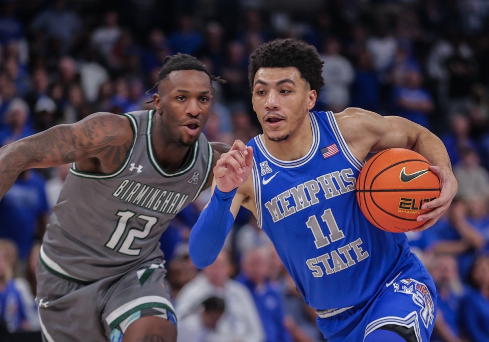 <strong>University of Memphis guard Jahvon Quinerly (11) drives to the basket during a March 3, 2024 game.</strong> (Patrick Lantrip/The Daily Memphian)