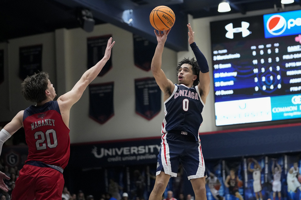 <strong>Gonzaga guard Ryan Nembhard (0) shoots over Saint Mary's guard Aidan Mahaney (20) during the second half of an NCAA college basketball game Saturday, March 2, 2024, in Moraga, Calif. Gonzaga beat Saint Mary&rsquo;s 70-57.</strong> (Godofredo A. V&aacute;squez/AP Photo)
