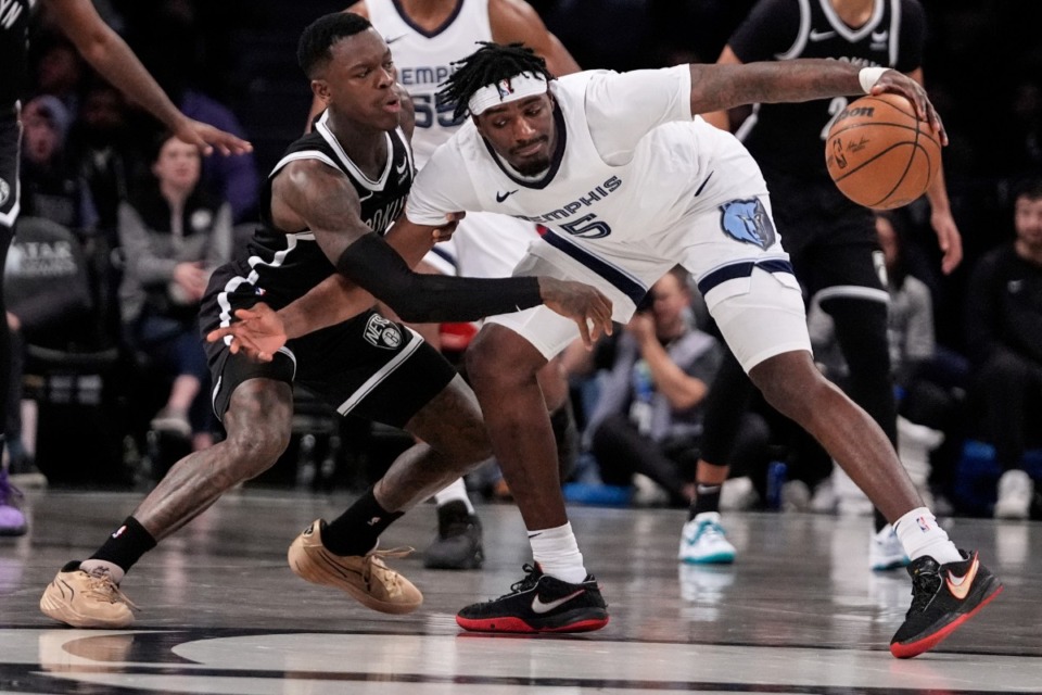 <strong>Memphis Grizzlies' Vince Williams Jr. (5) protects the ball from the Brooklyn Nets' Dennis Schroder on Monday, March 4, 2024, in New York.</strong> (Frank Franklin II/AP)