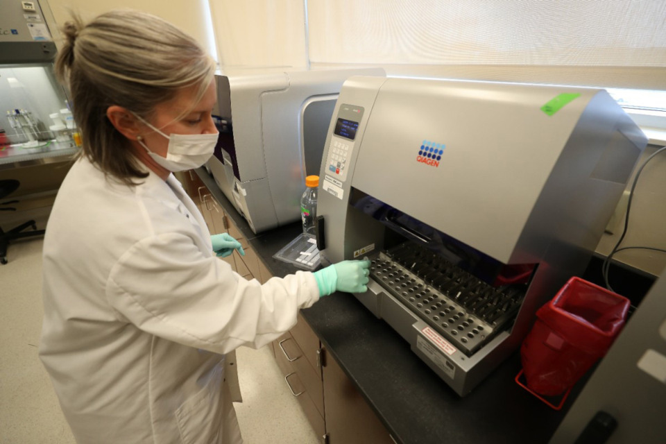 <strong>The Metro Nashville Police Department lab employs 61 people and costs Nashville taxpayers $8 million a year including salaries and benefits. A technician works with a sample at the lab.</strong> (Courtesy Metropolitan Nashville Police Department)