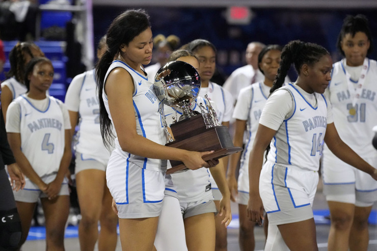 <strong>Bartlett's Dacarra Ward carries the team trophy after losing to Bradley Central in the Class 4A championship basketball game March 9 in Murfreesboro, Tenn.</strong> (Mark Humphrey/Special to The Daily Memphian)