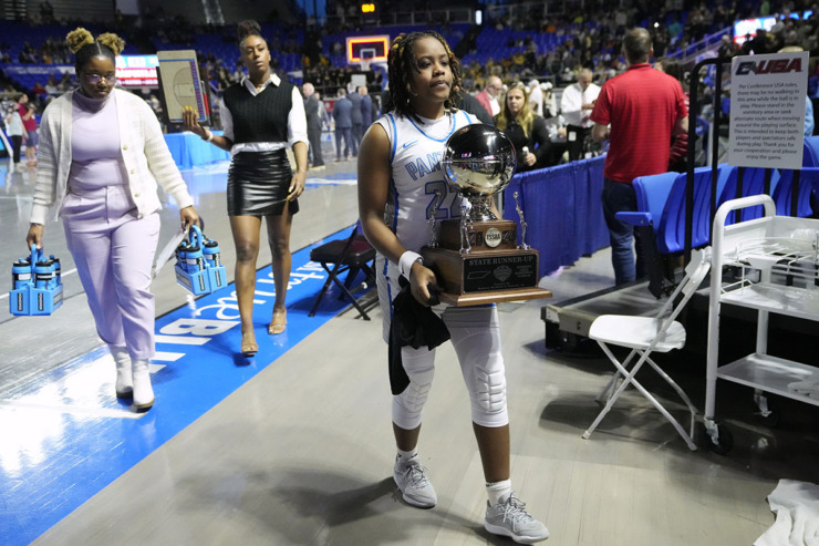 <strong>Bartlett's Shamari Hamlett (22) carries the runner-up trophy as the team leaves the court after losing to Bradley Central in the Class 4A championship basketball game March 9 in Murfreesboro, Tenn.</strong> (Mark Humphrey/Special to The Daily Memphian)