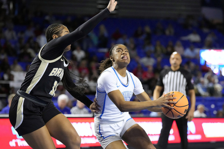 <strong>Bartlett's Carrington Jones, right, drives against Bradley Central's Harmonie Ware (11) during the first half of the Class 4A championship basketball game March 9 in Murfreesboro, Tenn.</strong> (Mark Humphrey/Special to The Daily Memphian)