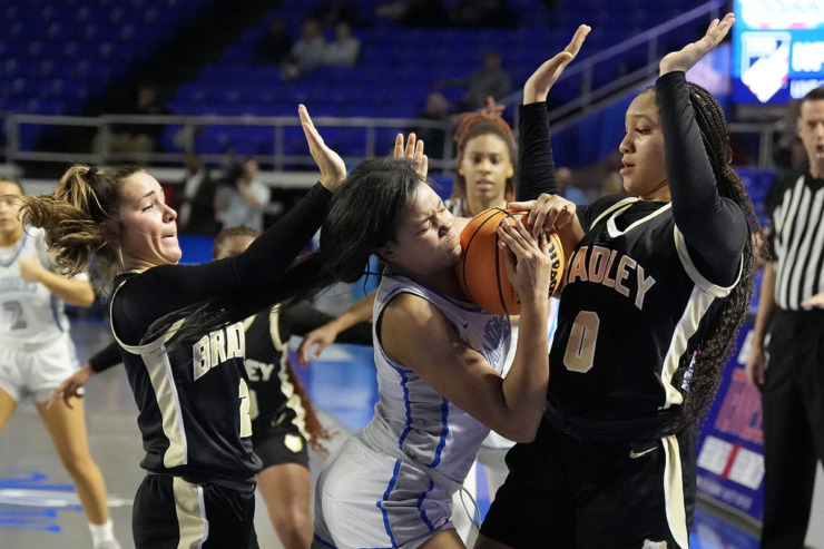 <strong>Bartlett's Dacarra Ward, center, is trapped by Bradley Central's Avary Brewer (2) and Kimora Fields (0) during the first half of the Class 4A championship basketball game March 9 in Murfreesboro, Tenn.</strong> (Mark Humphrey/Special to The Daily Memphian)