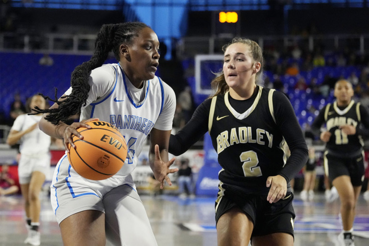 <strong>Bartlett's Brooklynn Spates (14) drives against Bradley Central's Avary Brewer (2) during the second half of the Class 4A championship basketball game March 9 in Murfreesboro, Tenn.</strong> (Mark Humphrey/Special to The Daily Memphian)