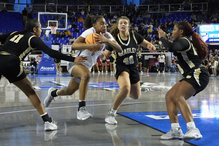 <strong>Bartlett's Carrington Jones (1) drives against Bradley Central defenders Harmonie Ware (11), Addie Geren (40), and Malia Wilcox, right, during the second half of the Class 4A championship basketball game March 9 in Murfreesboro, Tenn.</strong> (Mark Humphrey/Special to The Daily Memphian)