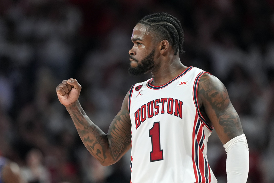 <strong>Houston's Jamal Shead celebrates during the first half of an NCAA college basketball game against Kansas Saturday, March 9, in Houston.</strong> (David J. Phillip/AP Photo)