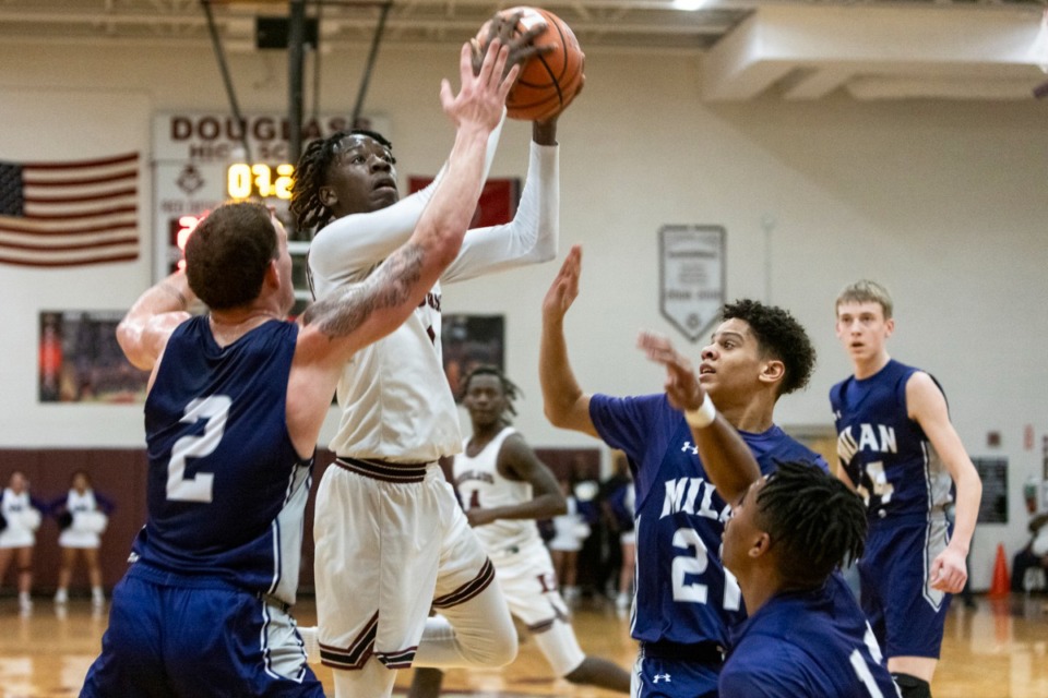 <strong>Douglass is the only undefeated boys basketball team in the state, and it&rsquo;s players like Taquez Butler (shooting) that got it there.</strong> (Brad Vest/The Daily Memphian file)