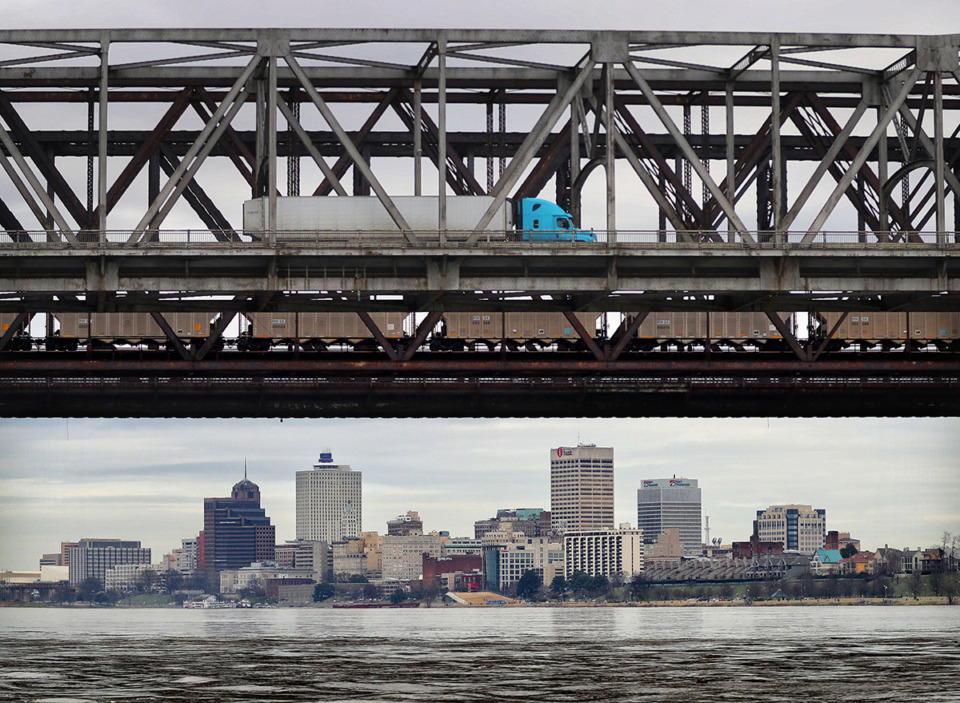 <strong>Truck and train traffic pass over the Mississippi River on the I-55 bridge. A replacement for the Memphis-Arkansas bridge could begin in 2026 if federal funding is secured.</strong> (Jim Weber/The Daily Memphian file)