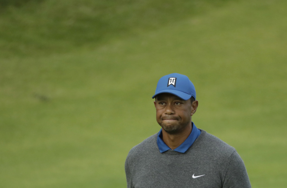 <span><strong>Tiger Woods of the United States looks up as he walks off the 18th green after completing his first round of the British Open Golf Championships at Royal Portrush in Northern Ireland, Thursday, July 18, 2019.</strong> (AP Photo/Matt Dunham)</span>