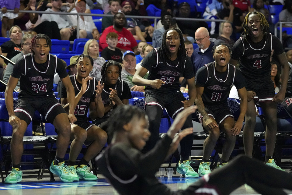 <strong>Douglass High School players cheer their teammates during the second half of a Class 2A basketball game against Austin-East Thursday, March 14, in Murfreesboro.</strong> (Mark Humphrey/Special to The Daily Memphian)
