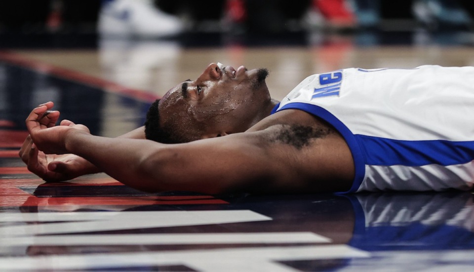 <strong>University of Memphis guard Jayhlon Young (1) lies on the court after a foul during the March 14, 2024, game against Wichita State in Fort Worth, Texas.</strong> (Patrick Lantrip/The Daily Memphian)