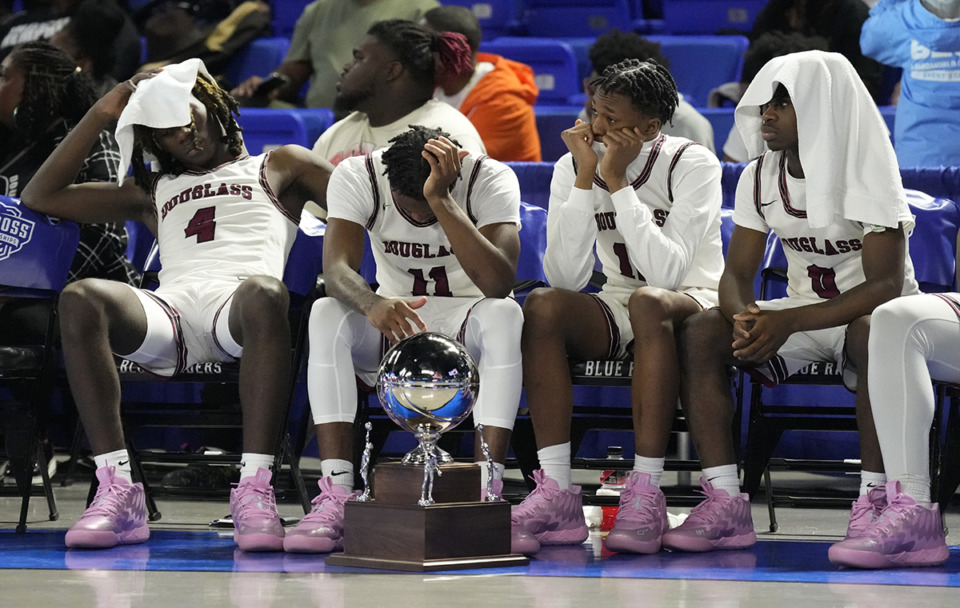 <strong>Douglass High School players sit with their trophy after losing to Alcoa in the Class 2A basketball championship game Saturday, March 16, in Murfreesboro, Tenn.</strong> (Mark Humphrey/Special to The Daily Memphian)
