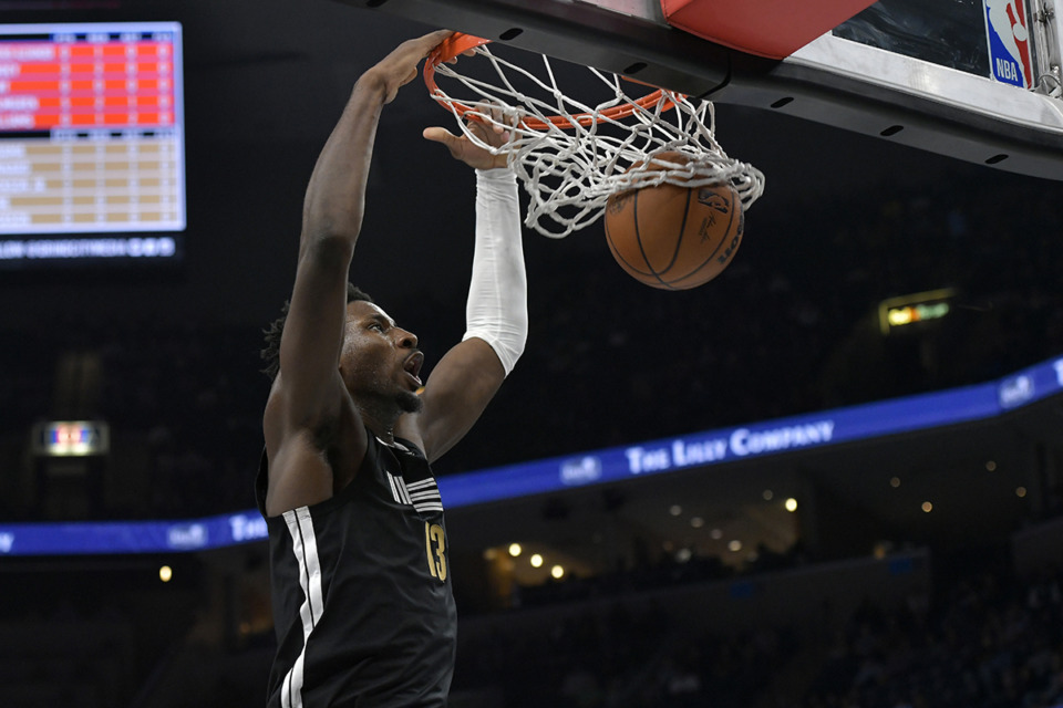 <strong>Memphis Grizzlies forward Jaren Jackson Jr. dunks in the first half of an NBA basketball game against the Oklahoma City Thunder, Saturday, March 16, in Memphis.</strong> (Brandon Dill/AP Photo)