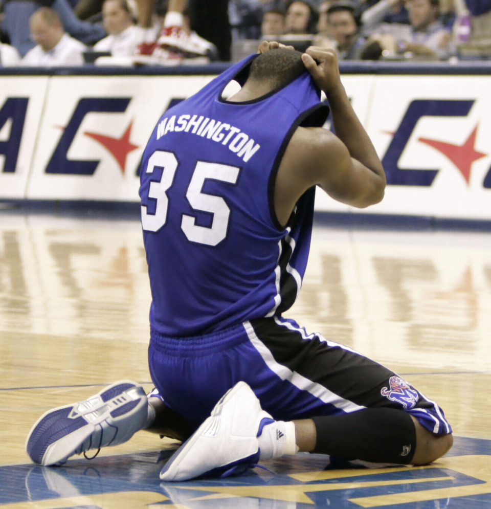 <span><strong>Darius Washington dropped to the floor after Memphis lost to Louisville 75-74 in the championship game of the Conference USA tournament in Memphis on March 12, 2005. Washington was fouled with no time left in the game and was given three free throws. He made his first free throw to bring Memphis within one point, but missed the final two.</strong> (AP File Photo/Mark Humphrey)</span>