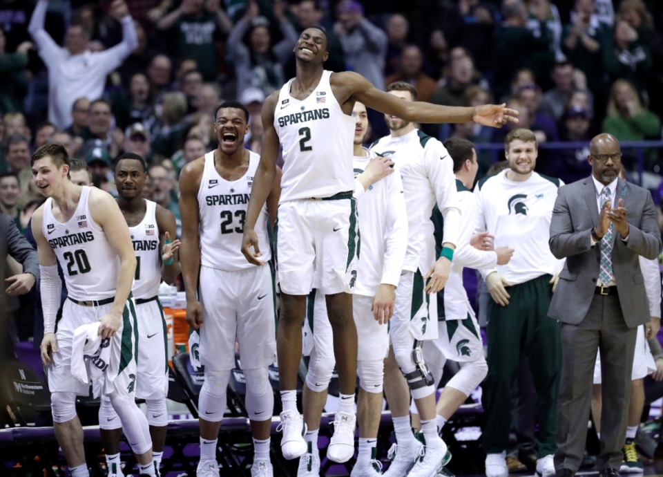 <strong>Michigan State forward Jaren Jackson, Jr. (2) smiles as he celebrates with teammates after guard Cassius Winston made a three-point basket during the second half of an NCAA college basketball game against Northwestern, in Rosemont, Ill. </strong>&nbsp;(AP Photo/Nam Y. Huh, File)