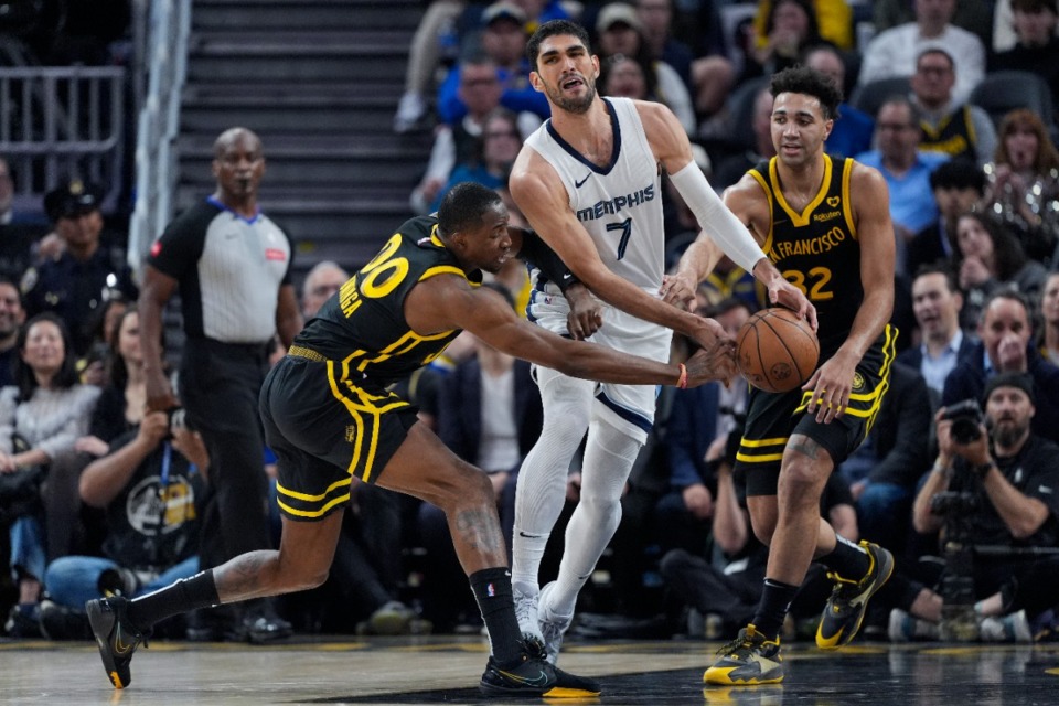 <strong>Golden State Warriors forward Jonathan Kuminga, left, and Memphis Grizzlies forward Santi Aldama (7) compete for possession of the ball on Wednesday, March 20, 2024, in San Francisco.</strong> (Godofredo A. V&aacute;squez/AP)