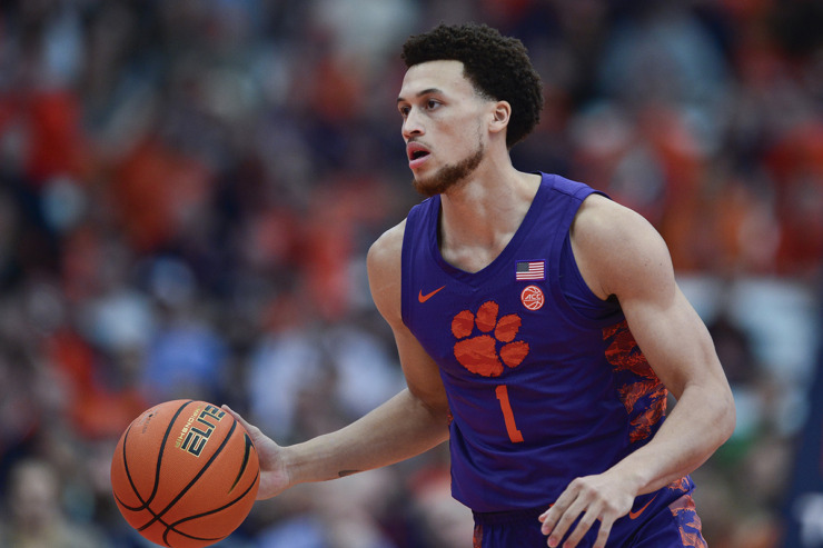 <strong>Clemson guard Chase Hunter (1) handles the ball during the first half of an NCAA college basketball game against Syracuse in Syracuse, N.Y., Saturday, Feb. 10.</strong> (Adrian Kraus/AP Photo file)