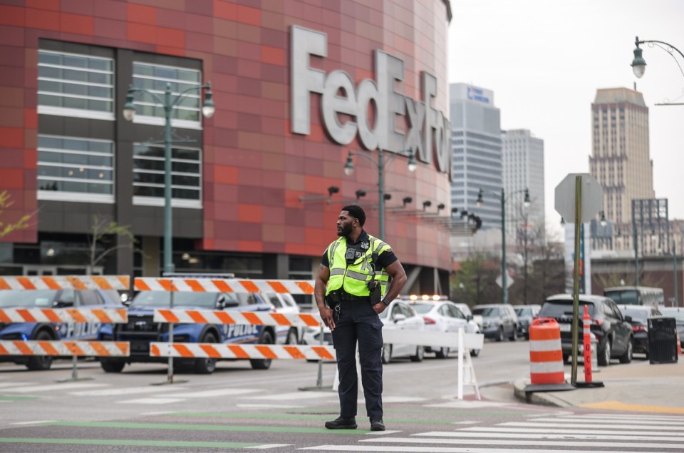 <strong>A Memphis police officer directs traffic outside of the FedExForum before the first round of the NCAA Tournament March 22, 2024.&nbsp;A man was shot at an apartment complex near FedExForum Friday morning just hours before Memphis is set to host first-round games in the NCAA Men&rsquo;s Basketball Tournament.</strong>(Patrick Lantrip/The Daily Memphian)