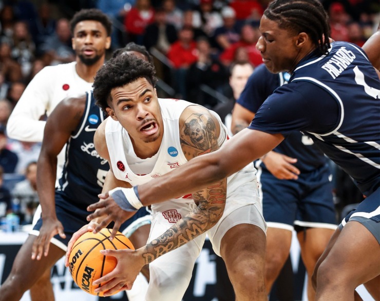 <strong>Houston guard Ramon Walker Jr. (left) grabs a rebound against Longwood during the NCAA Tournament game on Friday, March 22, 2024.</strong> (Mark Weber/The Daily Memphian)
